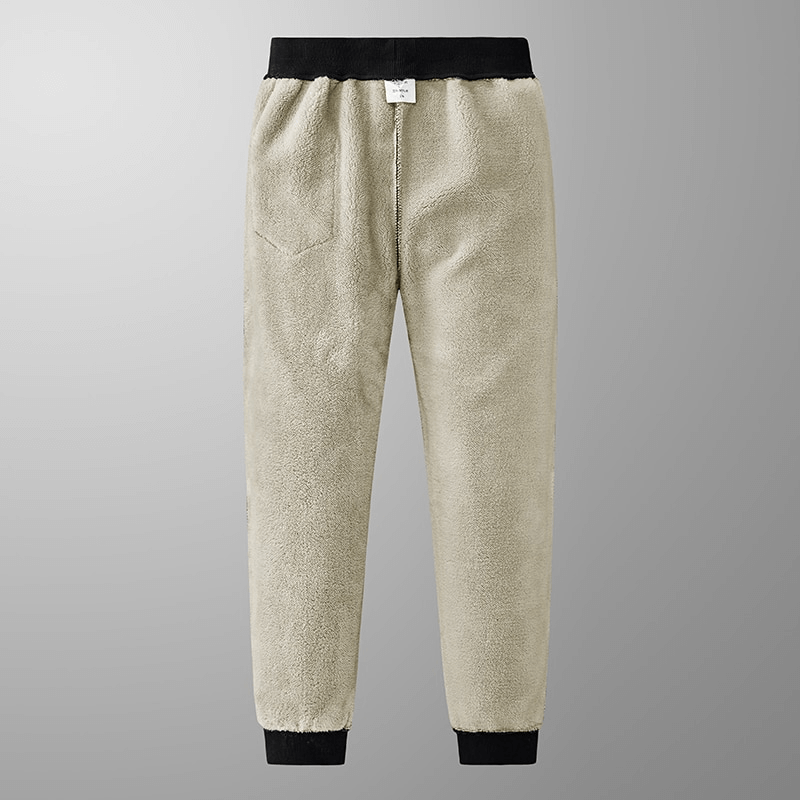 Warm men's joggers with cuffs and pockets, ideal for winter. Made from cotton and spandex, featuring a drawstring and mid-waist fit.